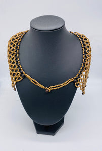 Woven pattern seed necklace accented with black seed beads