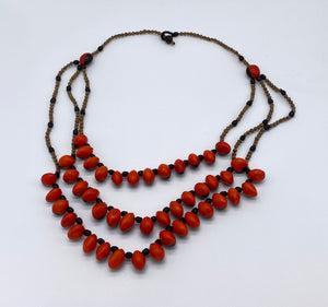 Three strand red seed necklace