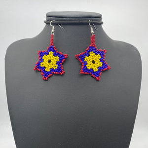 Dangling red, blue and yellow snowflake shaped earrings
