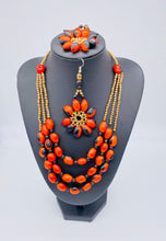 Load image into Gallery viewer, Stunning multi strand red seed necklace with matching earrings
