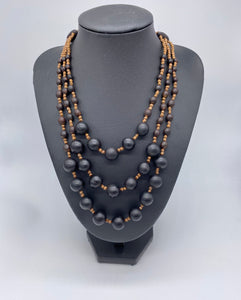 Triple layered black seed necklace