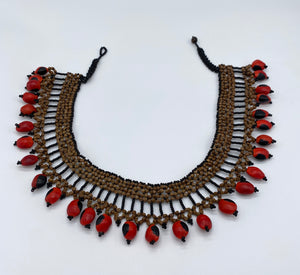 Thick band necklace edged with fiery seeds