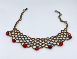 Braided seed necklace with accent red seeds