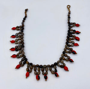 Star shaped red and grey seed necklace