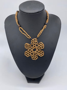 Geometric black accented seed necklace