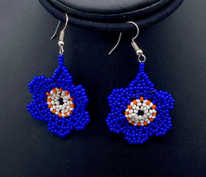 Cobalt blue with white and orange center of flower